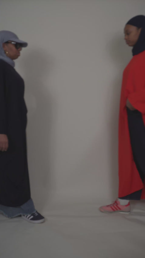 two people modeling the blue and red top